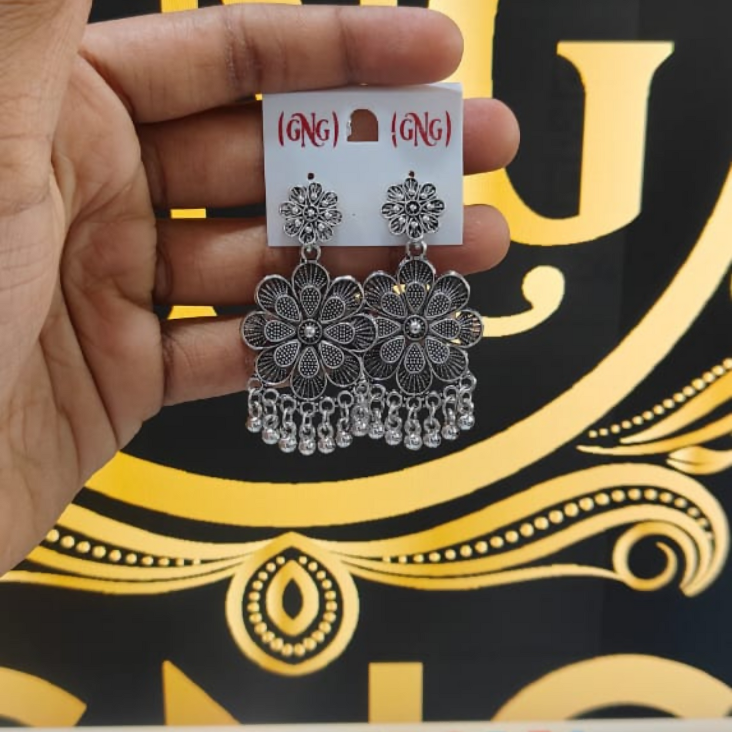 Elegant Oxidised Silver Jhumka Earings With Layered Floral Design