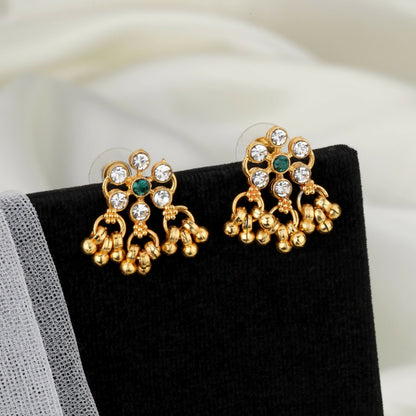 Close-up of gold lotus motifs with green enamel and pearl clusters