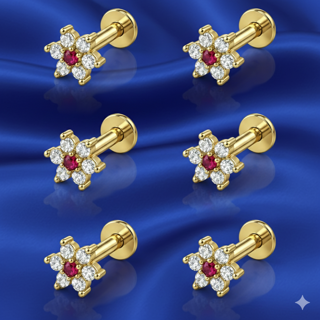 Close-up of ruby floral stud earring with gold plating and white zirconia accents