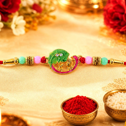 Mini Krishna Peacock Leaf Rakhi with elegant traditional design for Raksha Bandhan