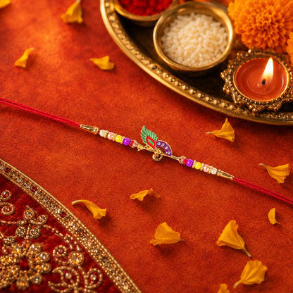 Traditional rakhi showcasing bird centerpiece and vibrant beads