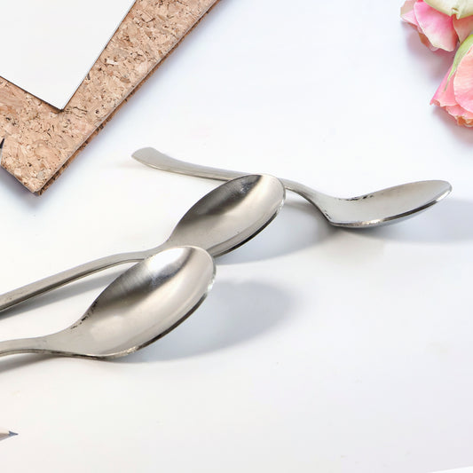 Three dining spoons arranged neatly as a set