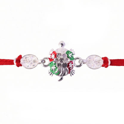 Turtle Rakhi with Red Thread and Crystal Embellishments