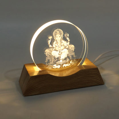 3D Lord Ganesha LED lamp glowing with warm light in dark room