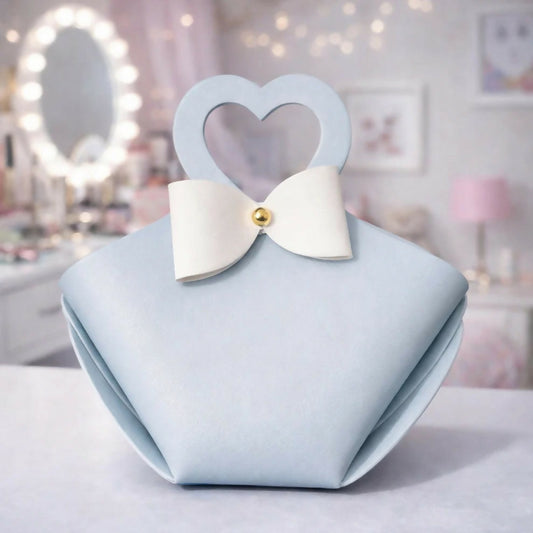 Light blue mini handbag with heart handle & bow, front view