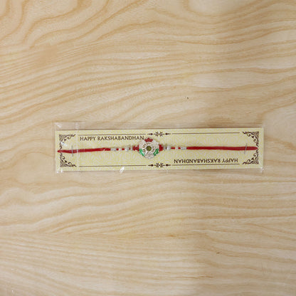 Green White Flower Rakhi with Silver Beads and Red Thread