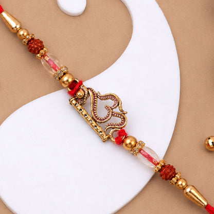 Om and Flute Pendant Rakhi with Rudraksha Beads