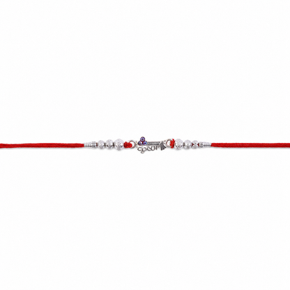 Silver Morpich Krishna Bead Rakhi with Tiny Purple Stone and Red Thread