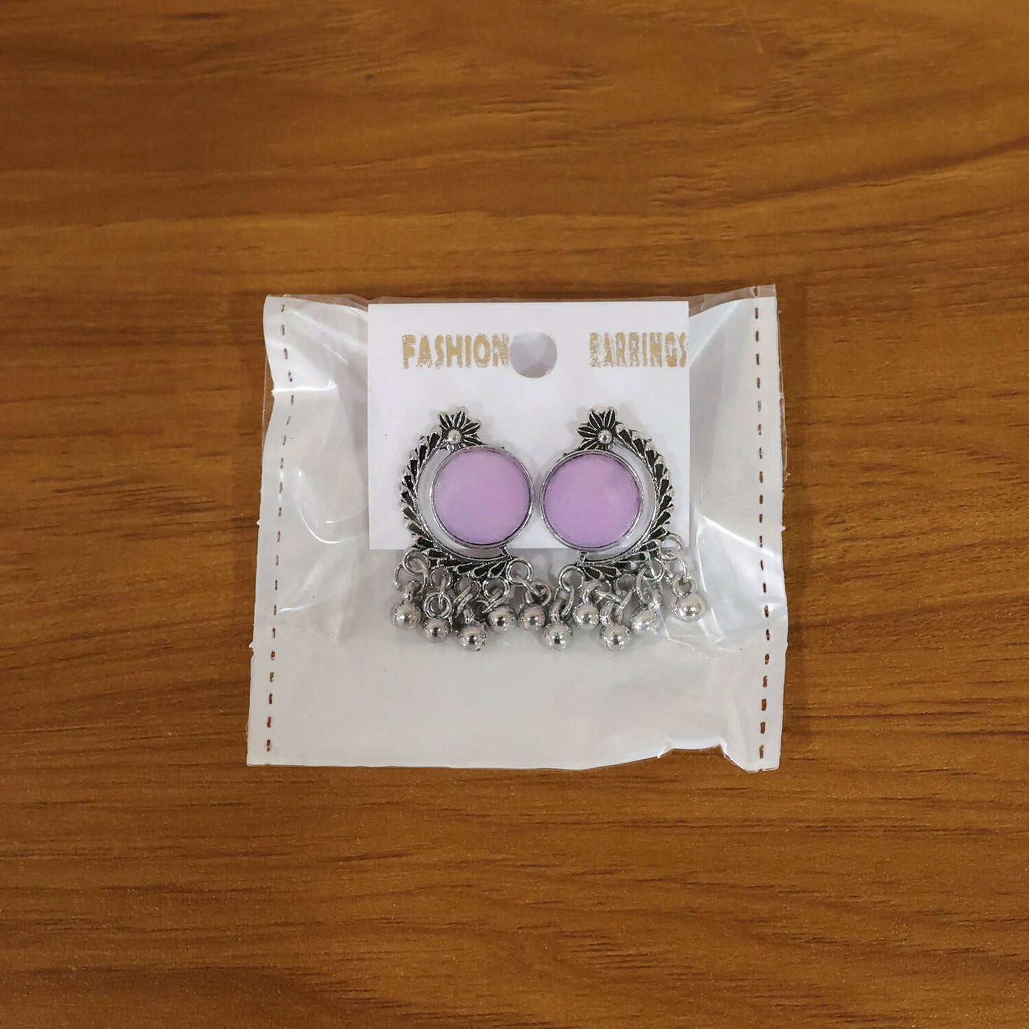 Lifestyle image of oxidized silver lavender stone earrings