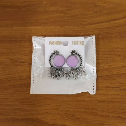 Lifestyle image of oxidized silver lavender stone earrings