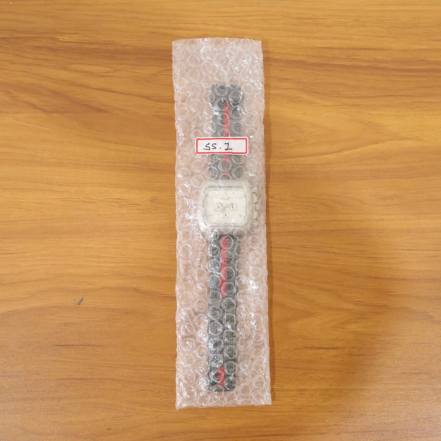 Men wearing premium square dial wrist watch with striped strap