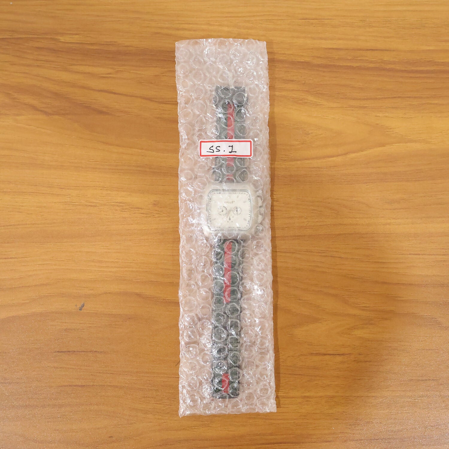 Men wearing premium square dial wrist watch with striped strap