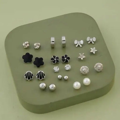 Floral and geometric design silver and black stud earrings from the set