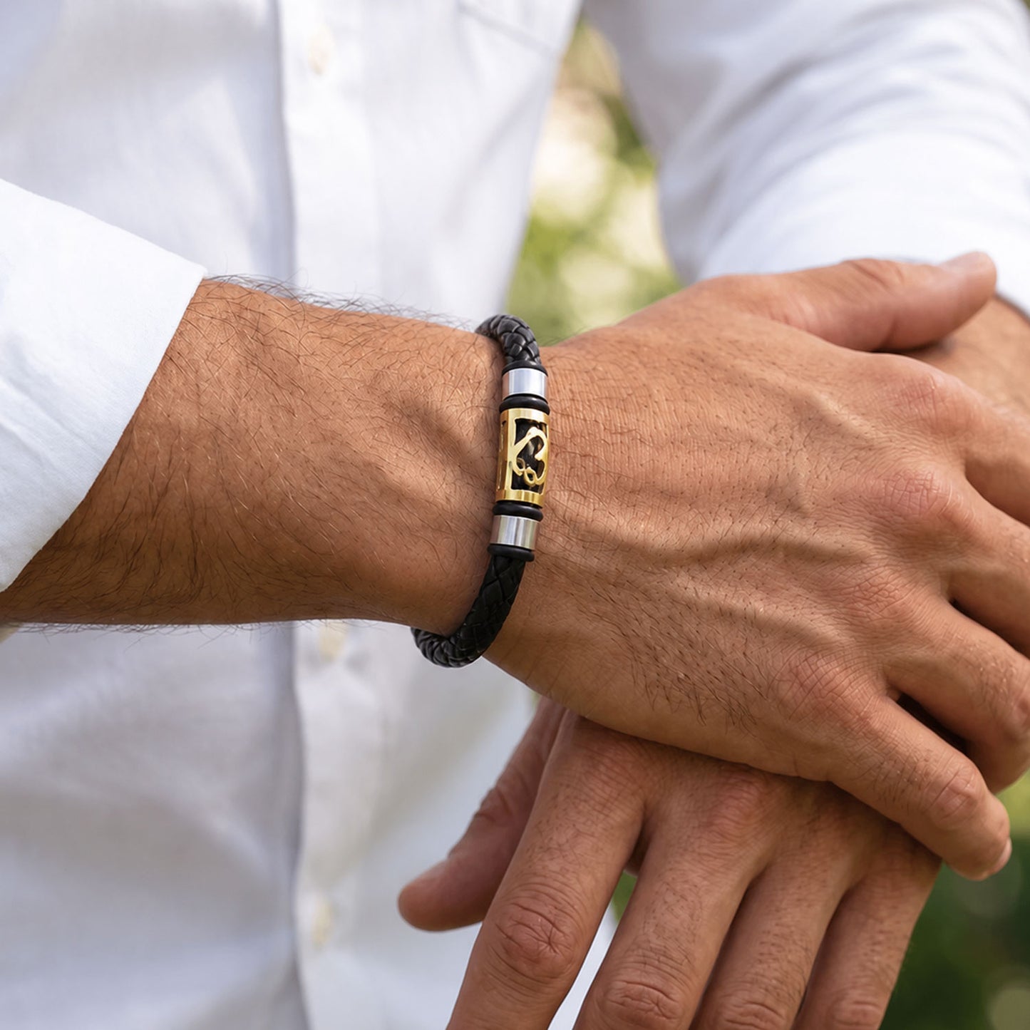 Sacred Symbol Rakhi with Black Braided Band and Gold Plaque for Raksha Bandhan Gift