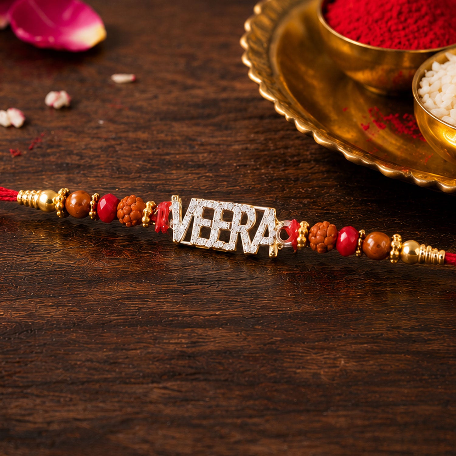 Veera Name Golden Designer Rakhi with Red Stones, Pearl Accents and Festive Beads