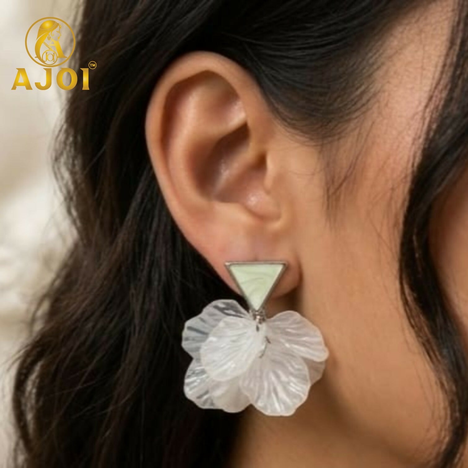 Close-up of handcrafted gemstone floral earrings set