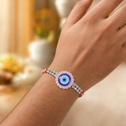 Premium Rakhi showcasing Evil Eye Charm, leaf touch and thread look for Gift Use