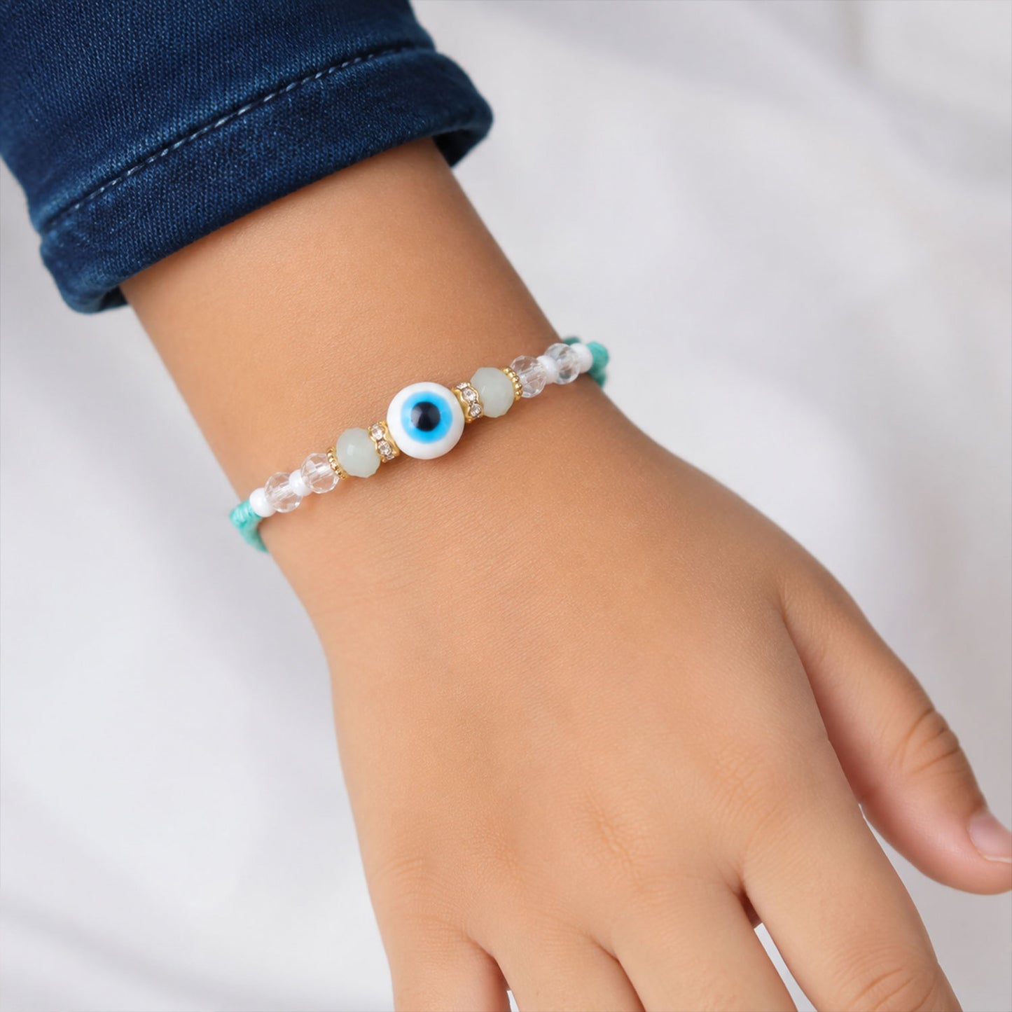 Blue Evil Eye Nazar Charm Rakhi with Turquoise Thread and Bracelet Style Beads