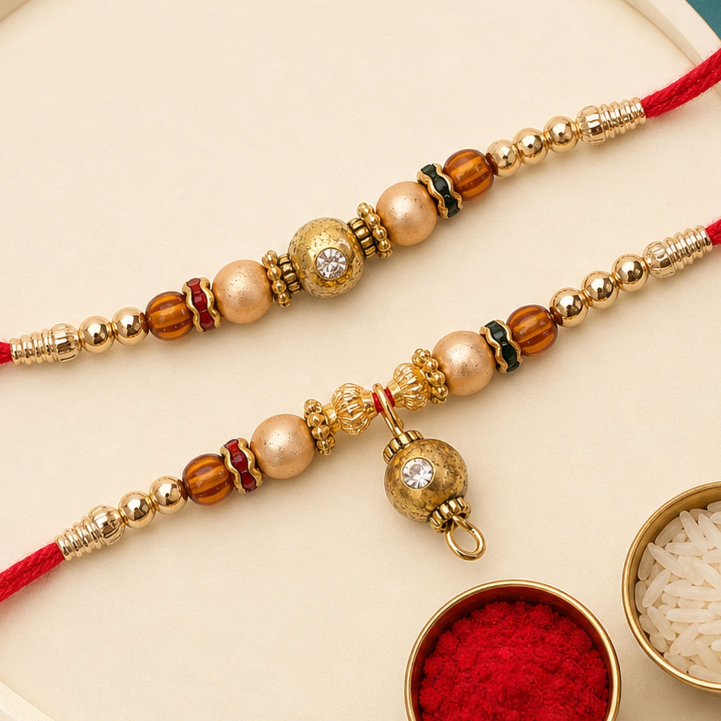Golden Orb Couple Rakhi Set with Amber Beads and Hanging Charm for Bhaiya Bhabhi