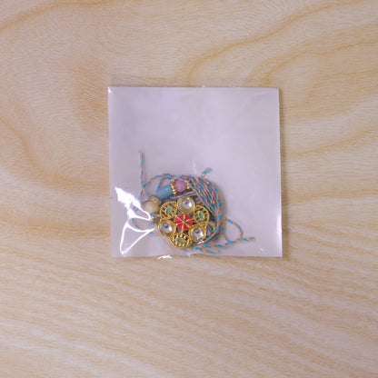 Blue Pink Floral Rakhi with Gold Medallion and Soft Festive Brother Gift Styling