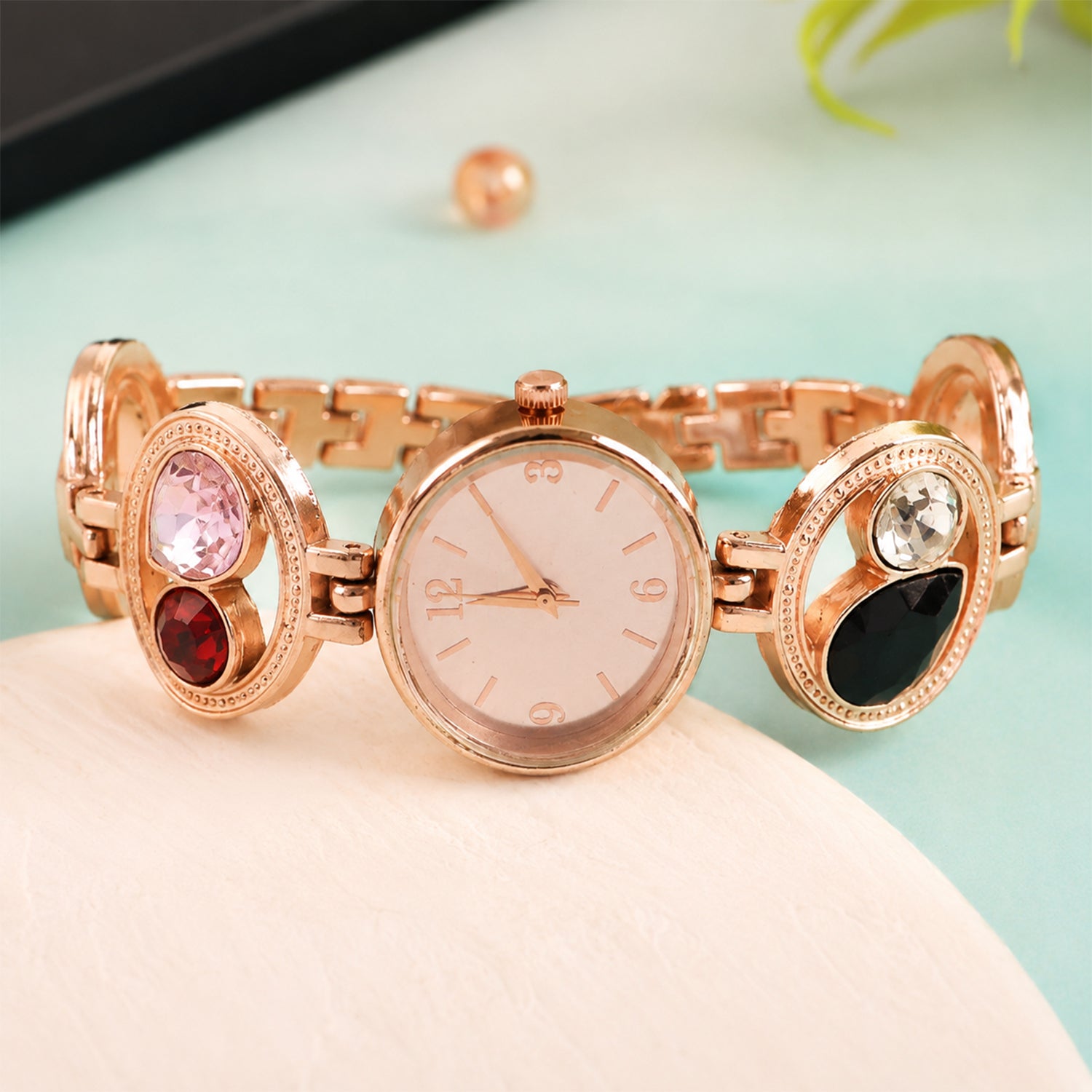 Women's wrist wearing the rose gold analog watch, showcasing its fit.