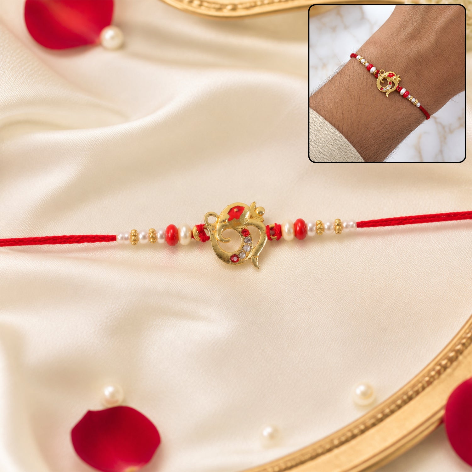 Golden Om Rakhi with Red Beads and Pearl Dotted Thread