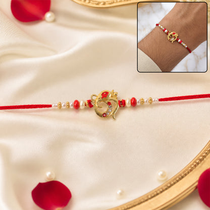 Golden Om Rakhi with Red Beads and Pearl Dotted Thread