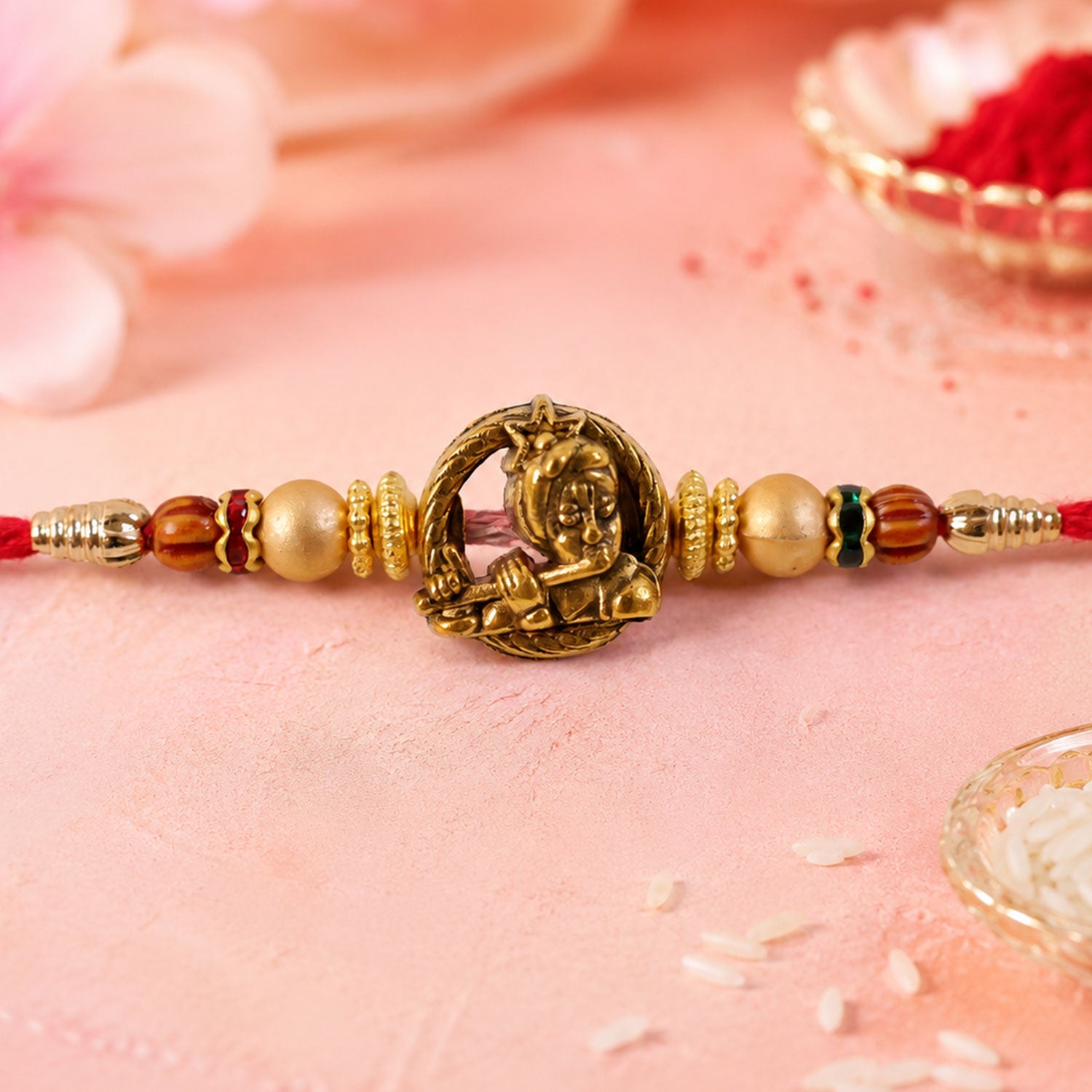 Kanha Krishna Name Devotional Rakhi with Golden Flute Detail and Red Thread