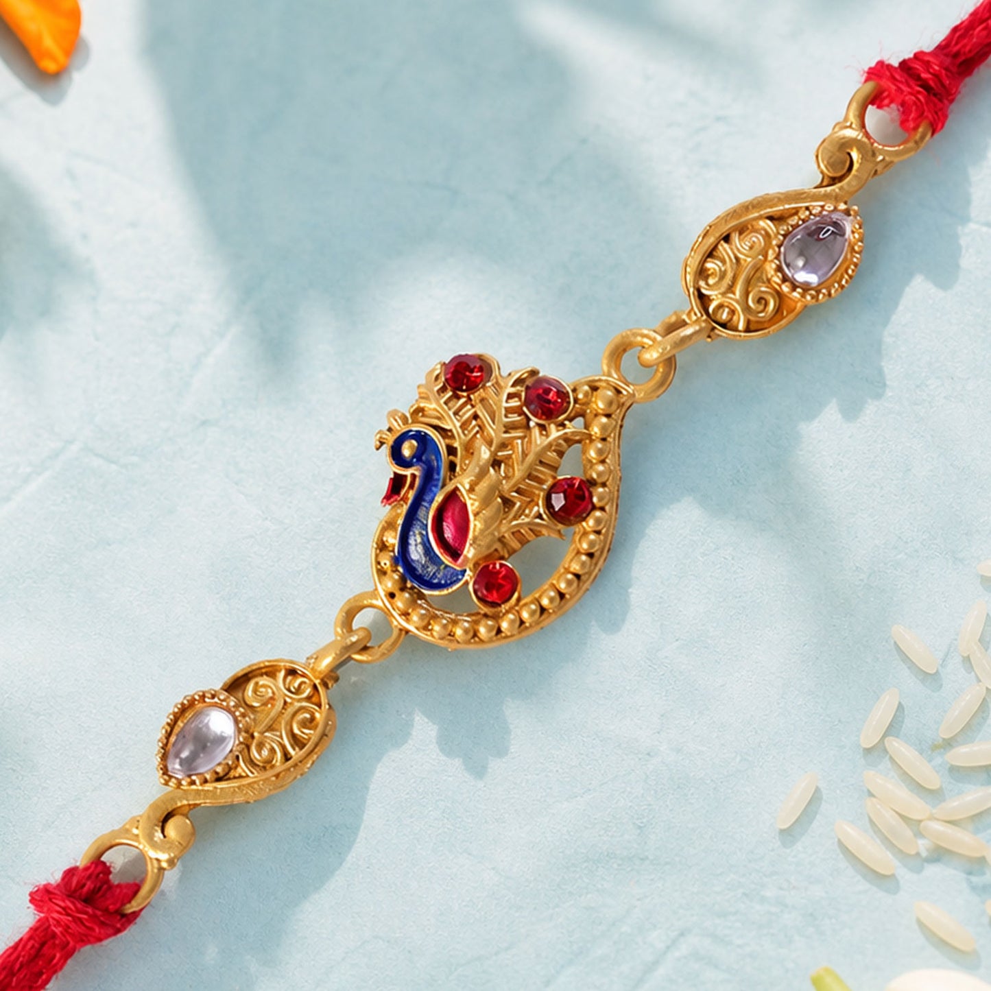 Festive Rakhi featuring Peacock Charm, pink accents and wrist style for Gift Styling