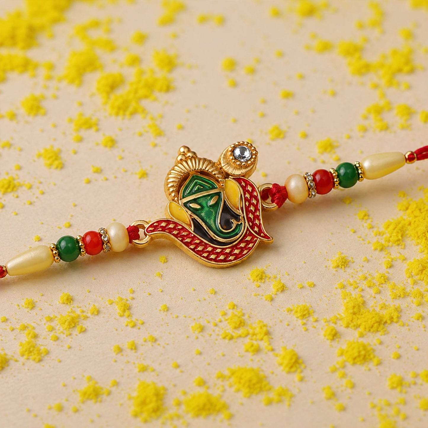 Ganpati Rakhi with detailed Lord Ganesha motif on festive background
