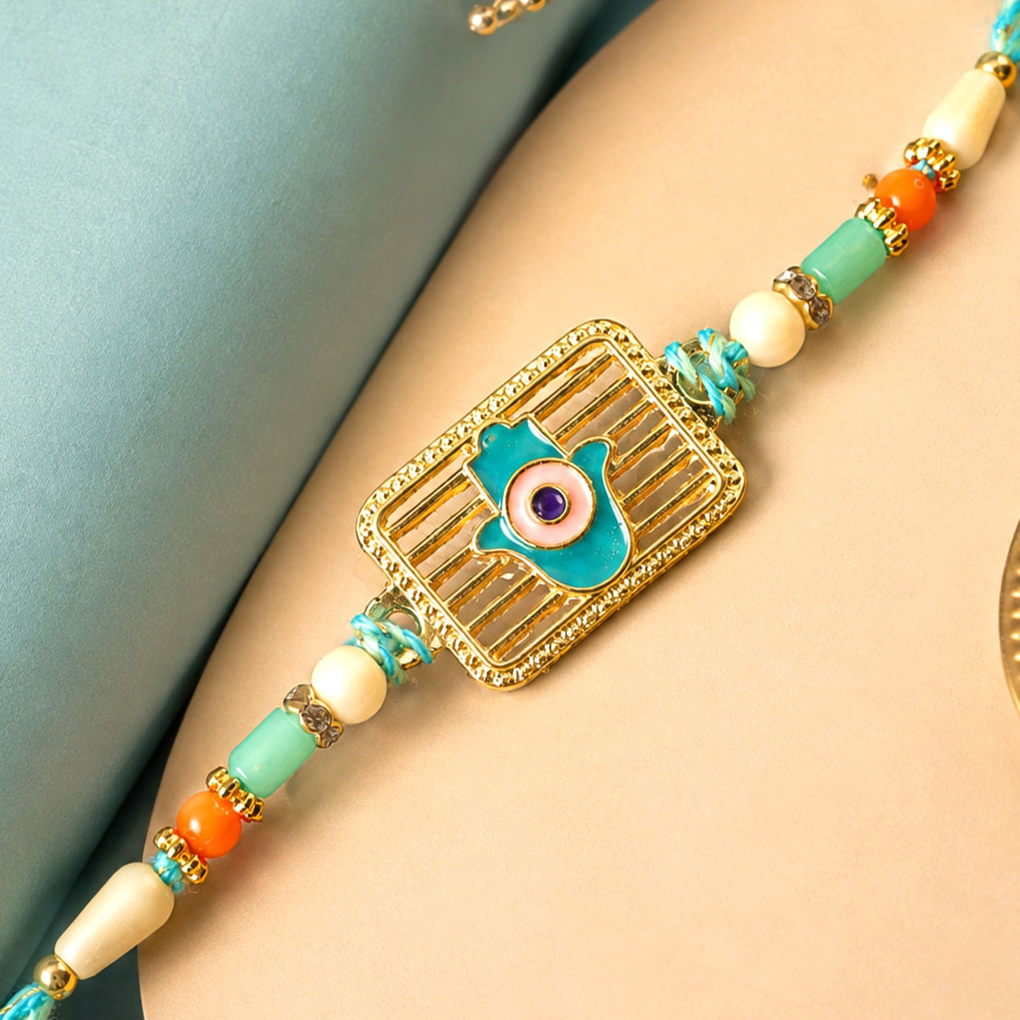 Evil Eye Square Charm Rakhi with Turquoise Beads and Modern Festive Gift Style Ideas