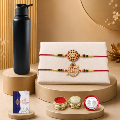 A black water bottle, two decorative bracelets on a white box, a small card, and three small containers are arranged on