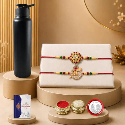 A black water bottle, two decorative bracelets on a white box, a small card, and three small containers are arranged on
