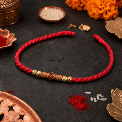 Red Cord Rakhi with Rudraksha and Natural Wooden Bead Accents