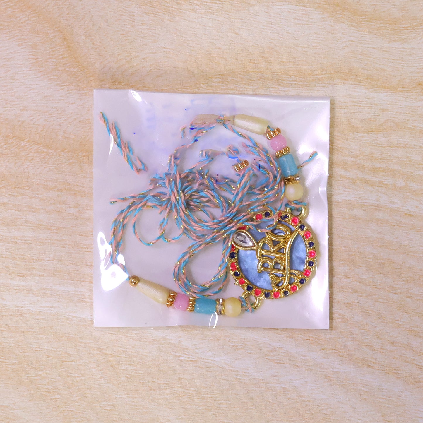 Bro Text Pendant Rakhi with Pink and Navy Kundan Stones