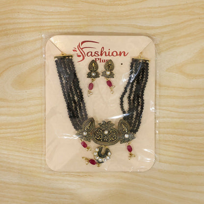 Matching earrings from black beaded necklace set