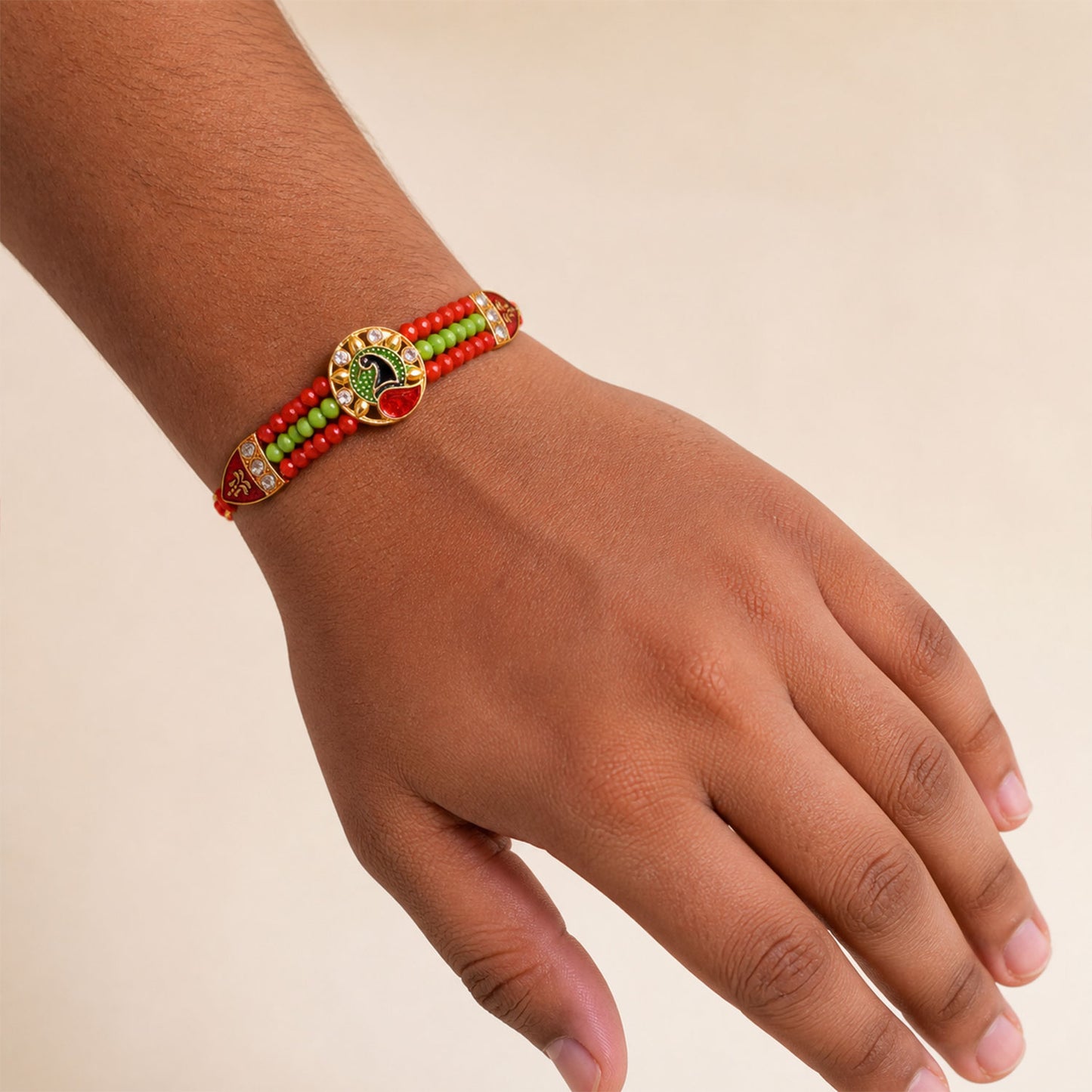 Red Green Beaded Rakhi with Gold Medallion and Bright Traditional Festive Gift Style