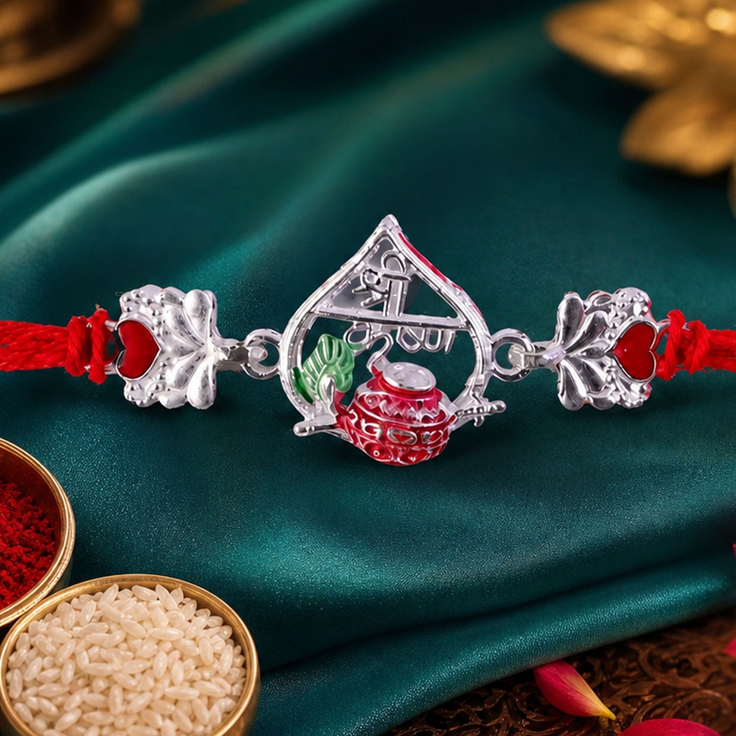 Silver Peacock Meenakari Rakhi with red and green accents on a plain background.