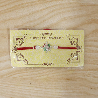 Turtle Rakhi with Red Thread and Crystal Embellishments