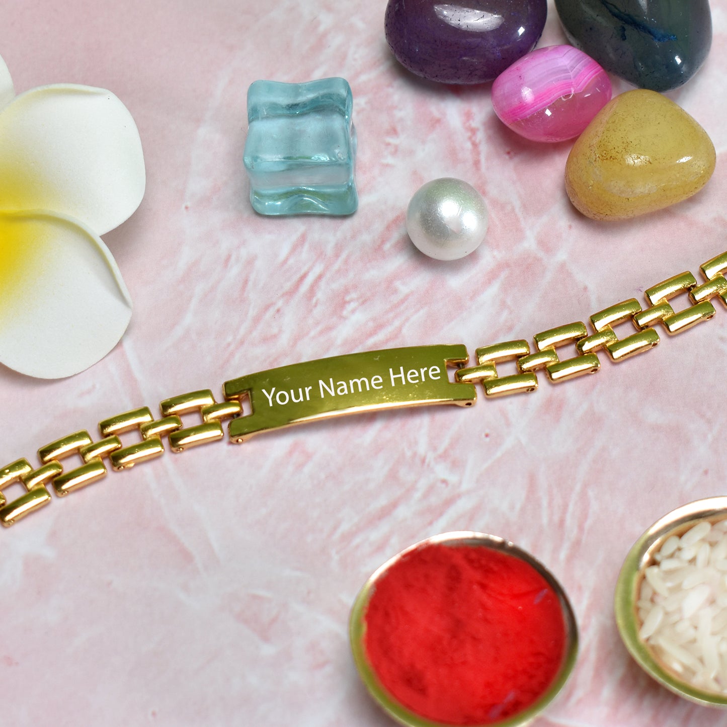 Close-up of a laser-engraved name on a personalized plate bracelet.