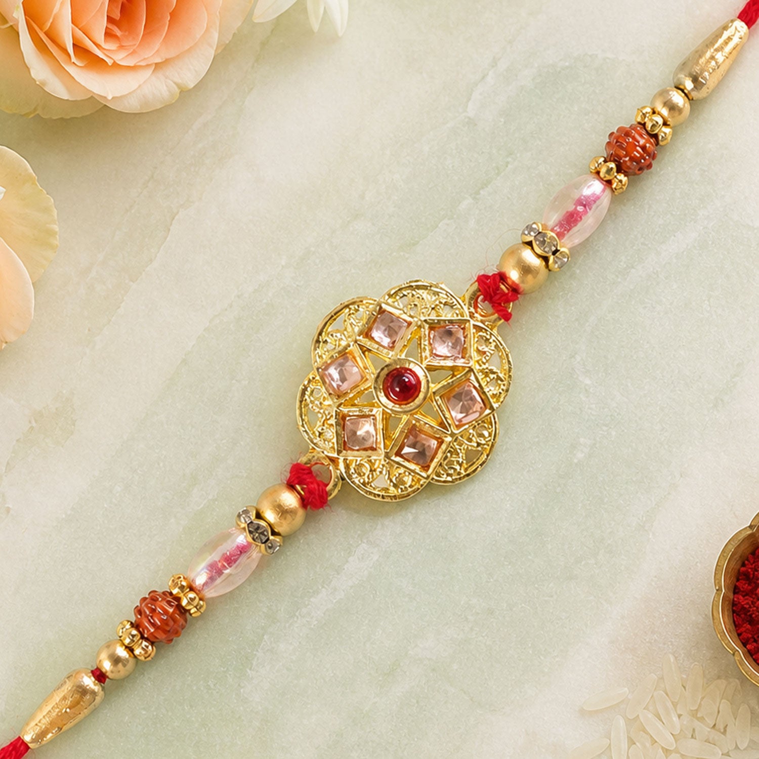 Divine Rakhi with Circular Sacred Medallion and gold trims in chain look for Gift Use