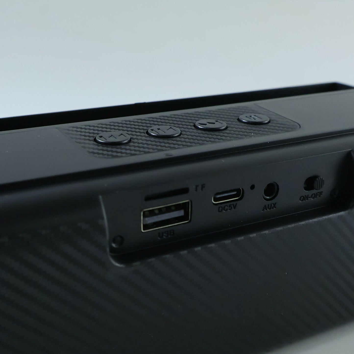 Compact Bluetooth soundbar with multifunctional controls.
