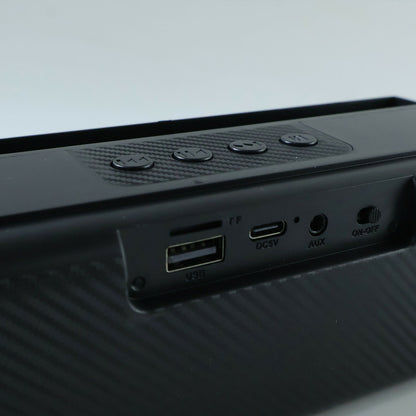 Compact Bluetooth soundbar with multifunctional controls.