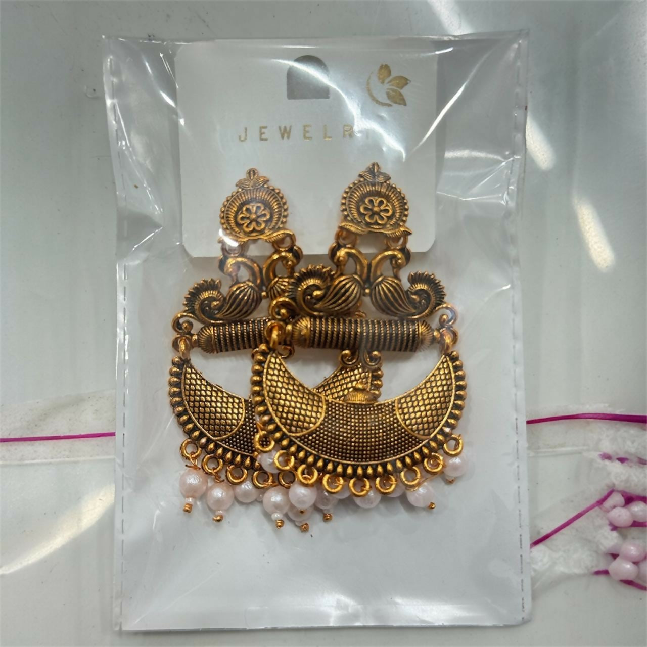 Antique Gold Tribal Chandbali Earrings with Pearl Drops & Peacock Motif