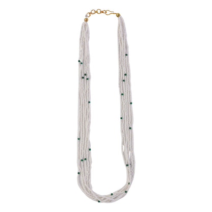 Side view showcasing layered pearl necklace design