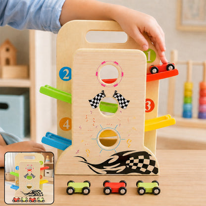 A child's hands place a red toy car on top of a wooden ramp racer with colorful tracks.