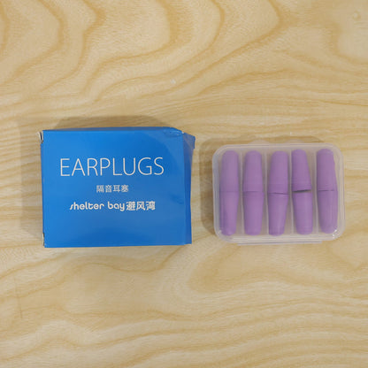 Multiple purple foam earplugs shown with the clear storage case.