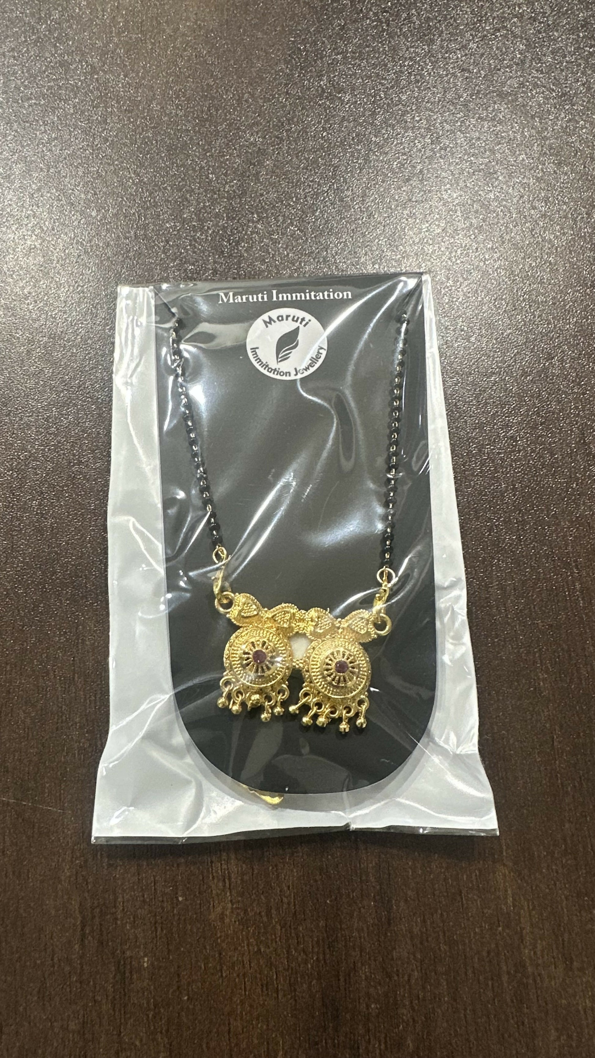 The Couple in Heart Design Magalsutra.