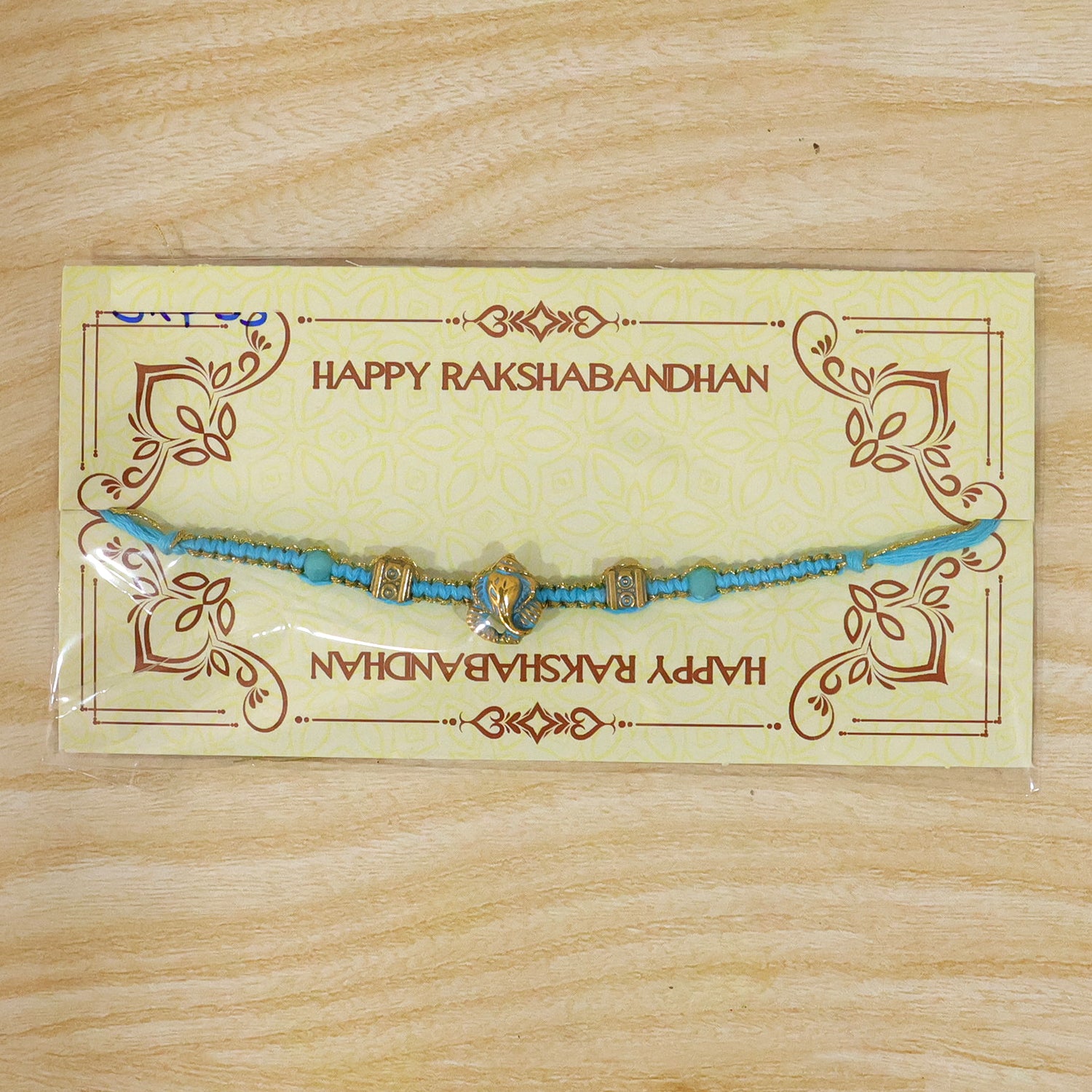 Turquoise Center Designer Rakhi with Gold Tone Detail and Elegant Bracelet Beauty