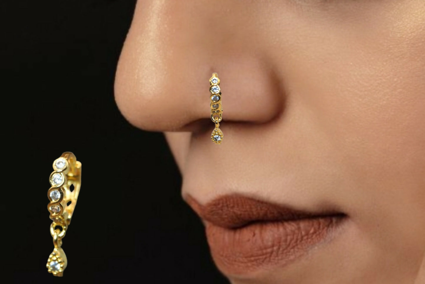 Close-up of gold plated crystal drop nosepin showcasing sparkling crystals